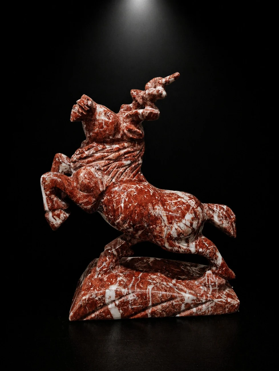 Red horse and rider sculpture